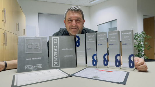 John Thornhill displaying his 9x ClickBank Platinum vendor awards from 2020 to 2026